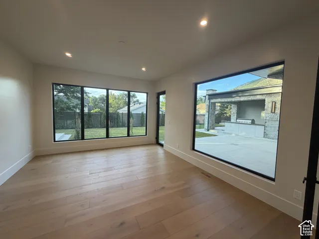 flex room, large picture windows bringing in lots of natural light and a view to the backyard. Also features a door to the backyard