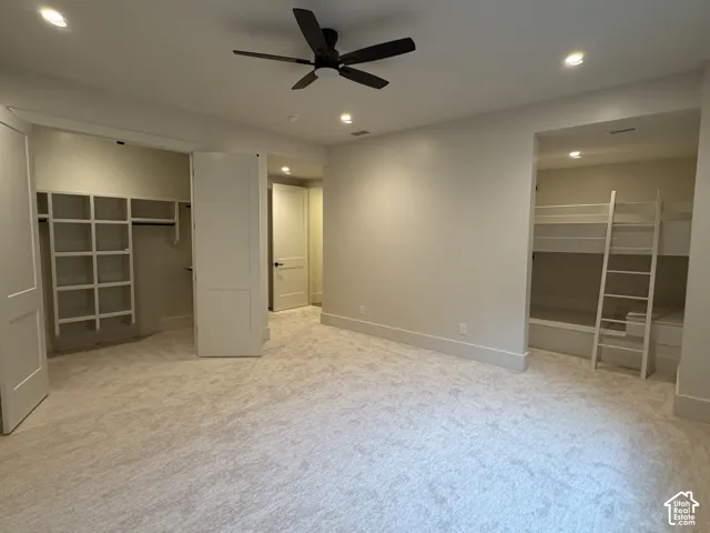 basement ensuite bedroom 1 with bunk room, walk-in closet and full bathroom with shower