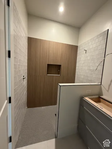 Bathroom in the private guest suite with walk in shower, vanity, recessed lighting, and beautiful custom tile work and separate toilet room