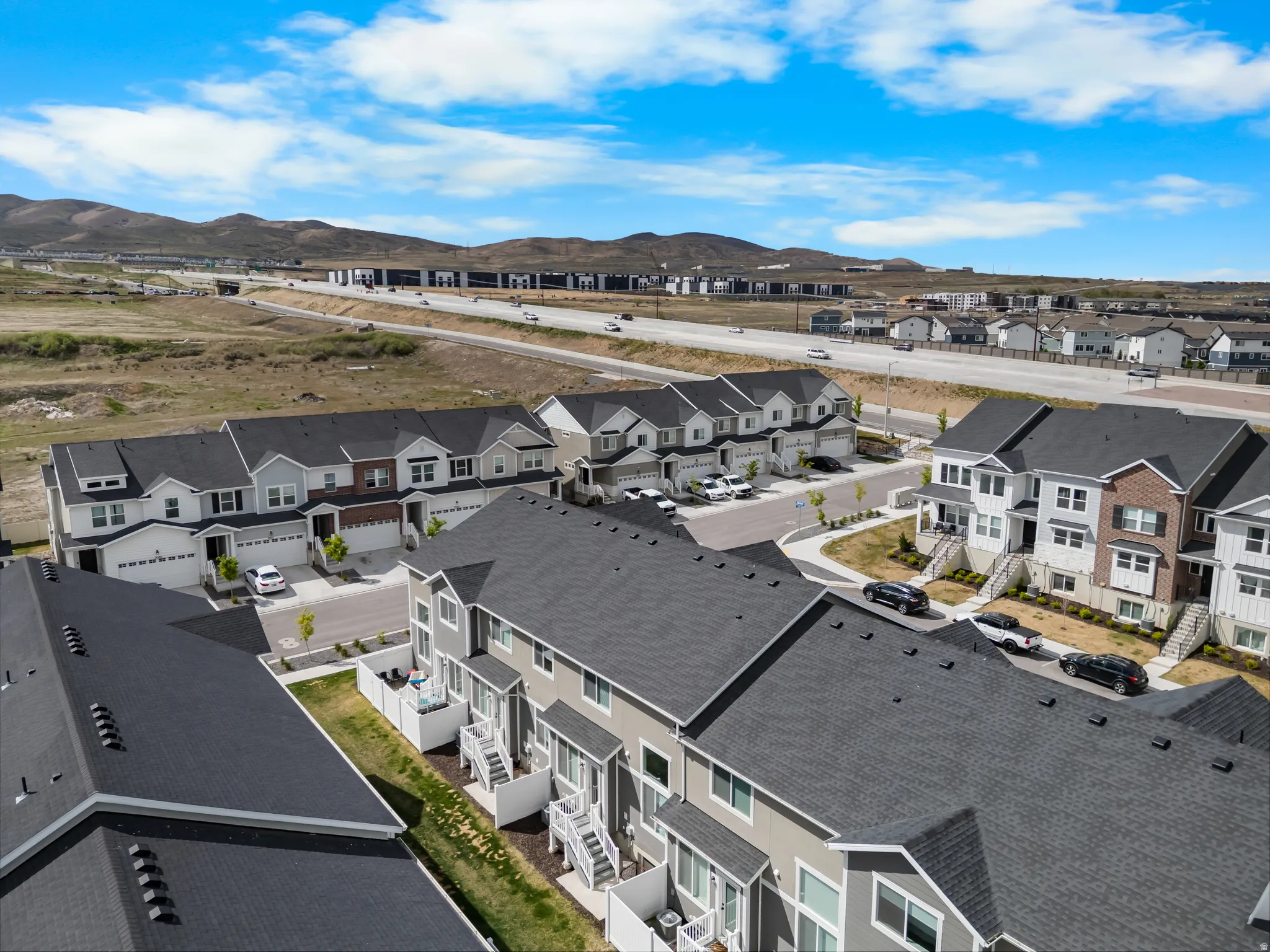Aerial view of residential area featuring a mountain backdrop