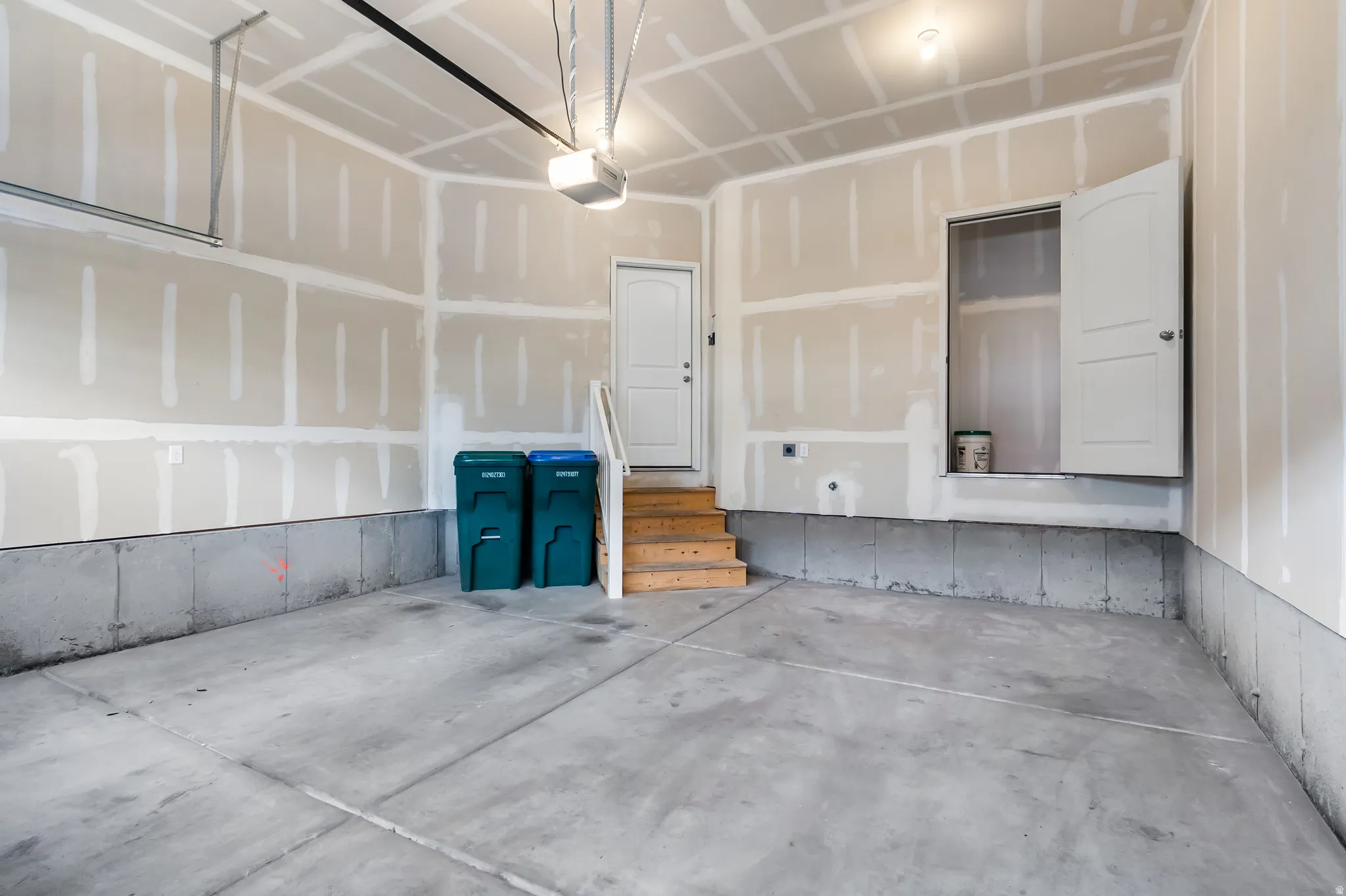 Garage featuring a garage door opener