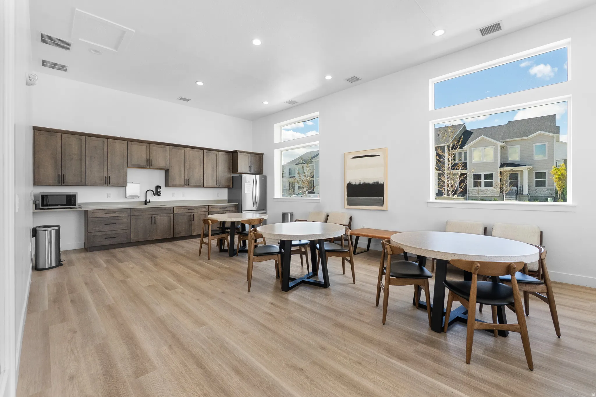 Dining space featuring light wood-style flooring and recessed lighting