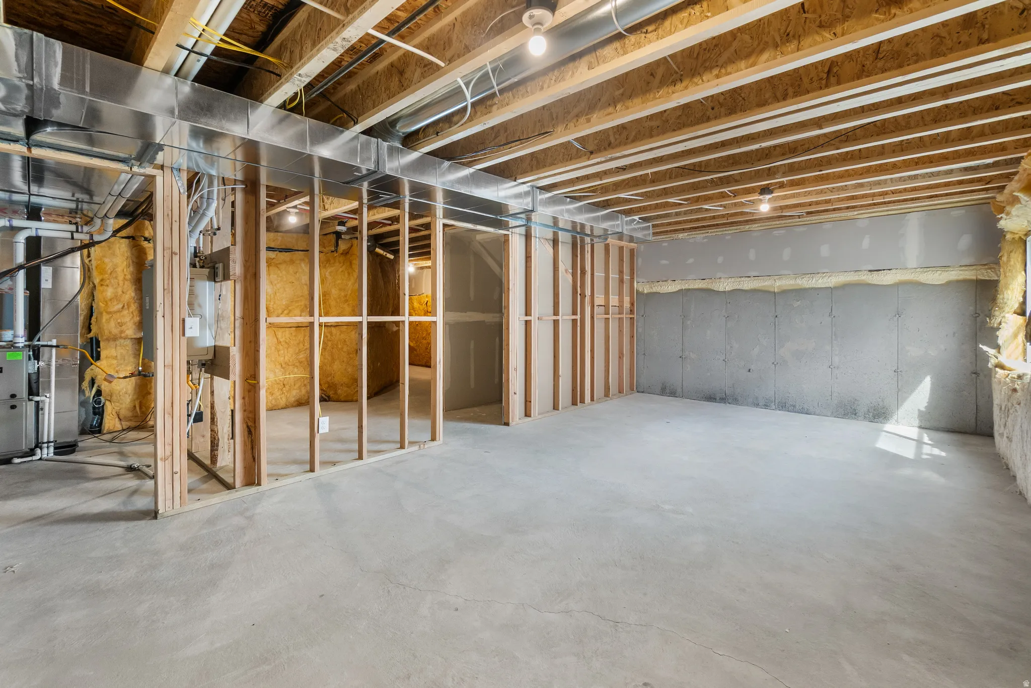 Unfinished below grade area with heating unit