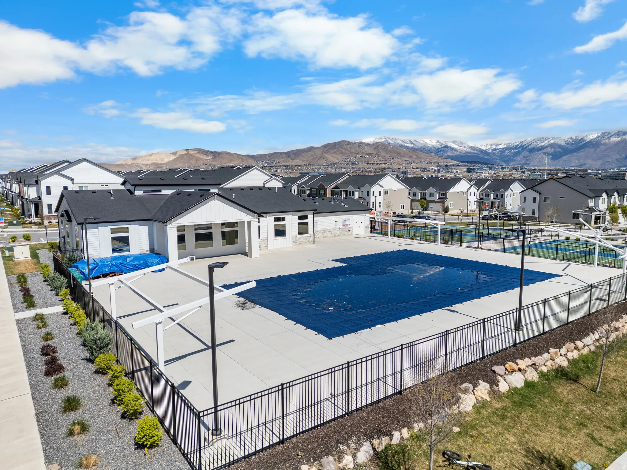 Community pool featuring a mountain view, a residential view, and a patio
