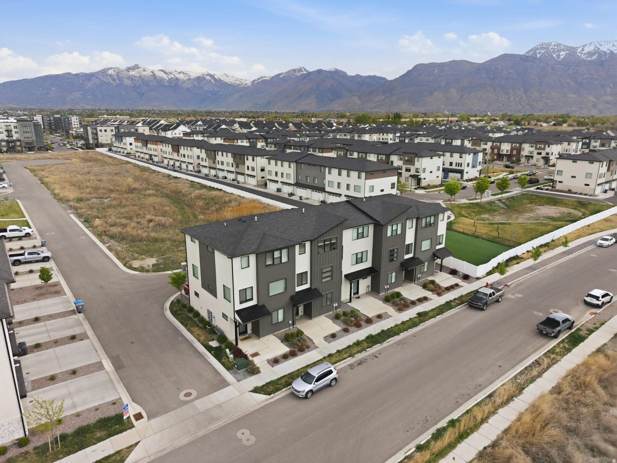 Aerial perspective of suburban area with a mountainous background