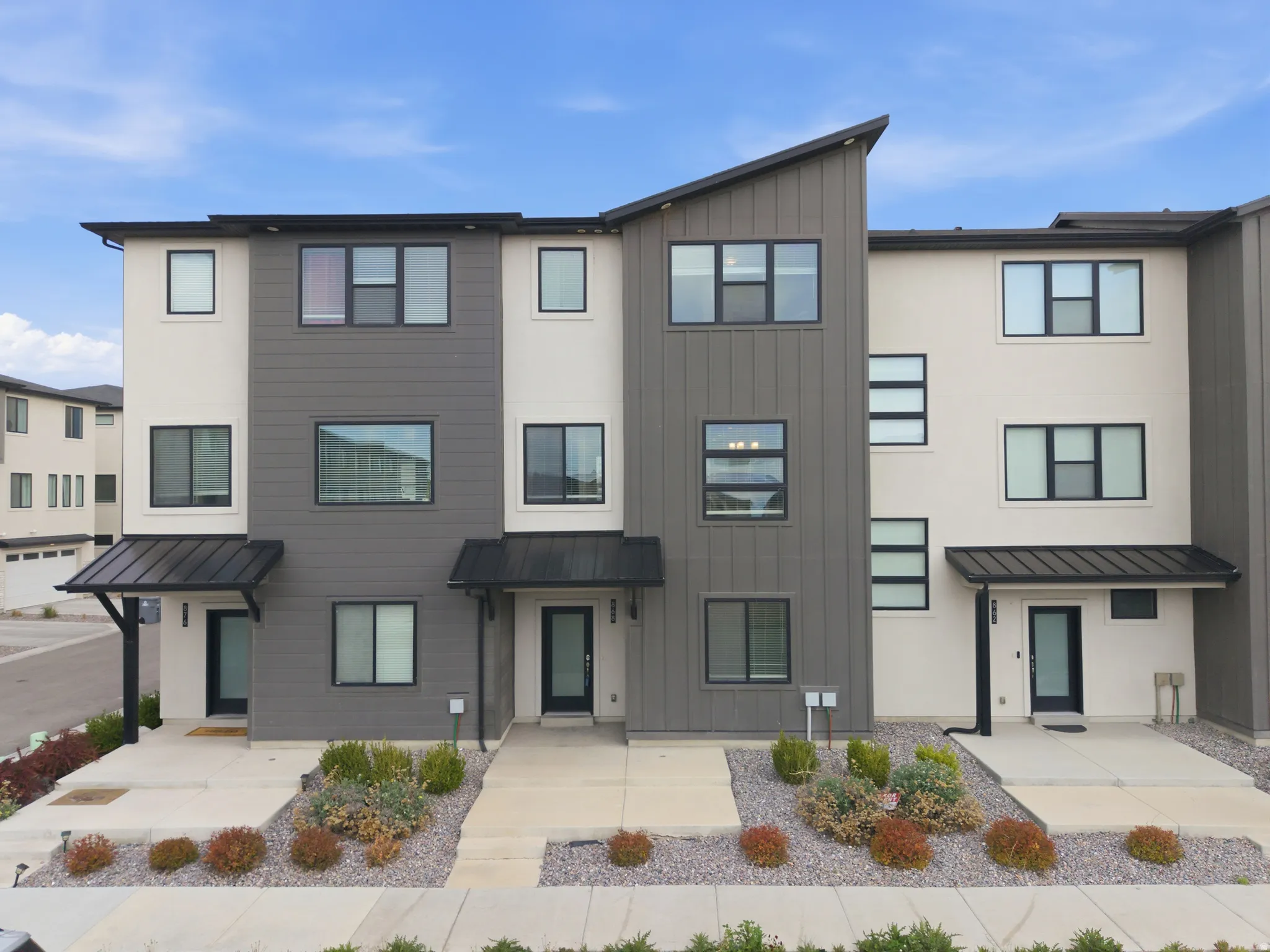 Contemporary house with a standing seam roof and board and batten siding