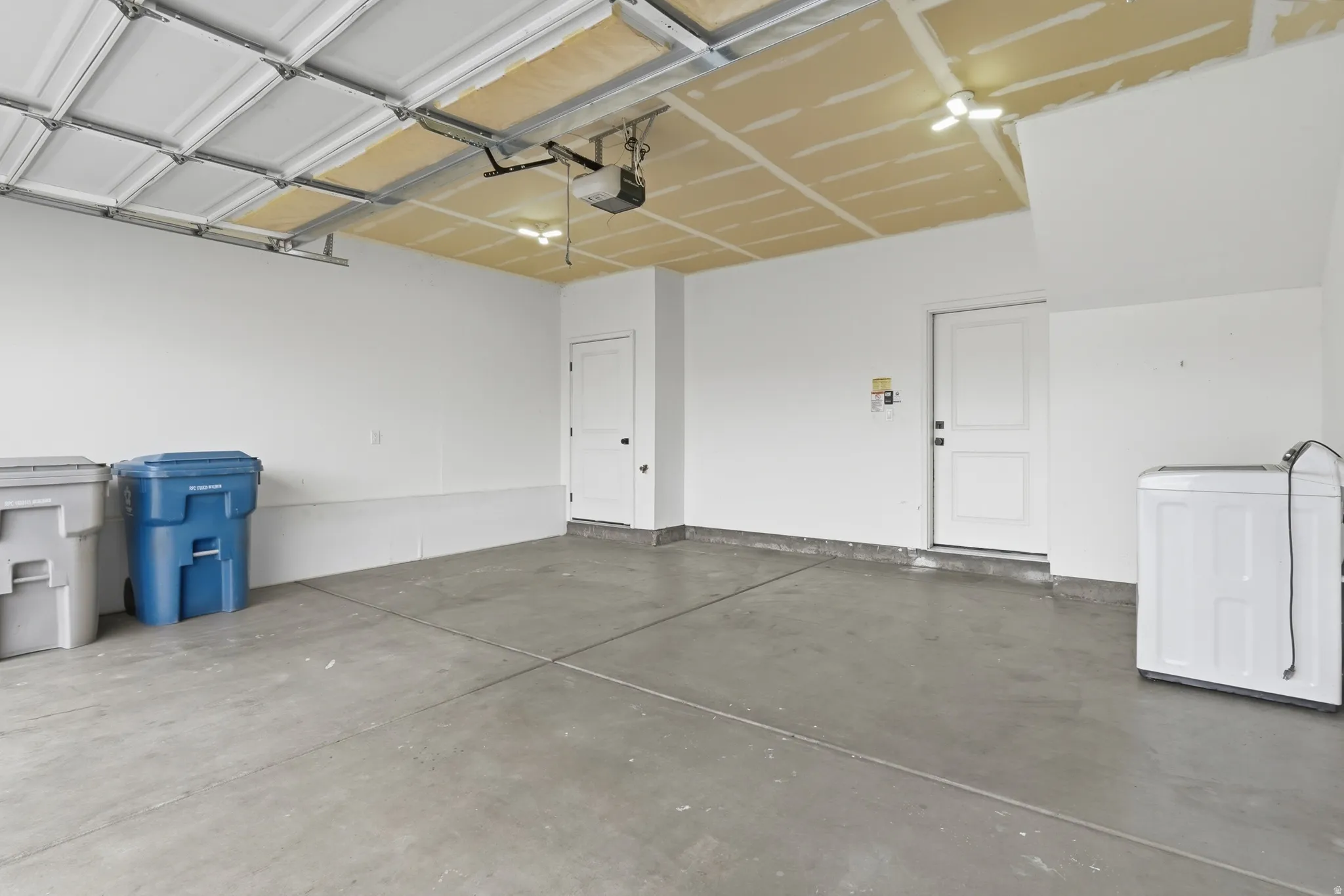 Garage with washer / clothes dryer