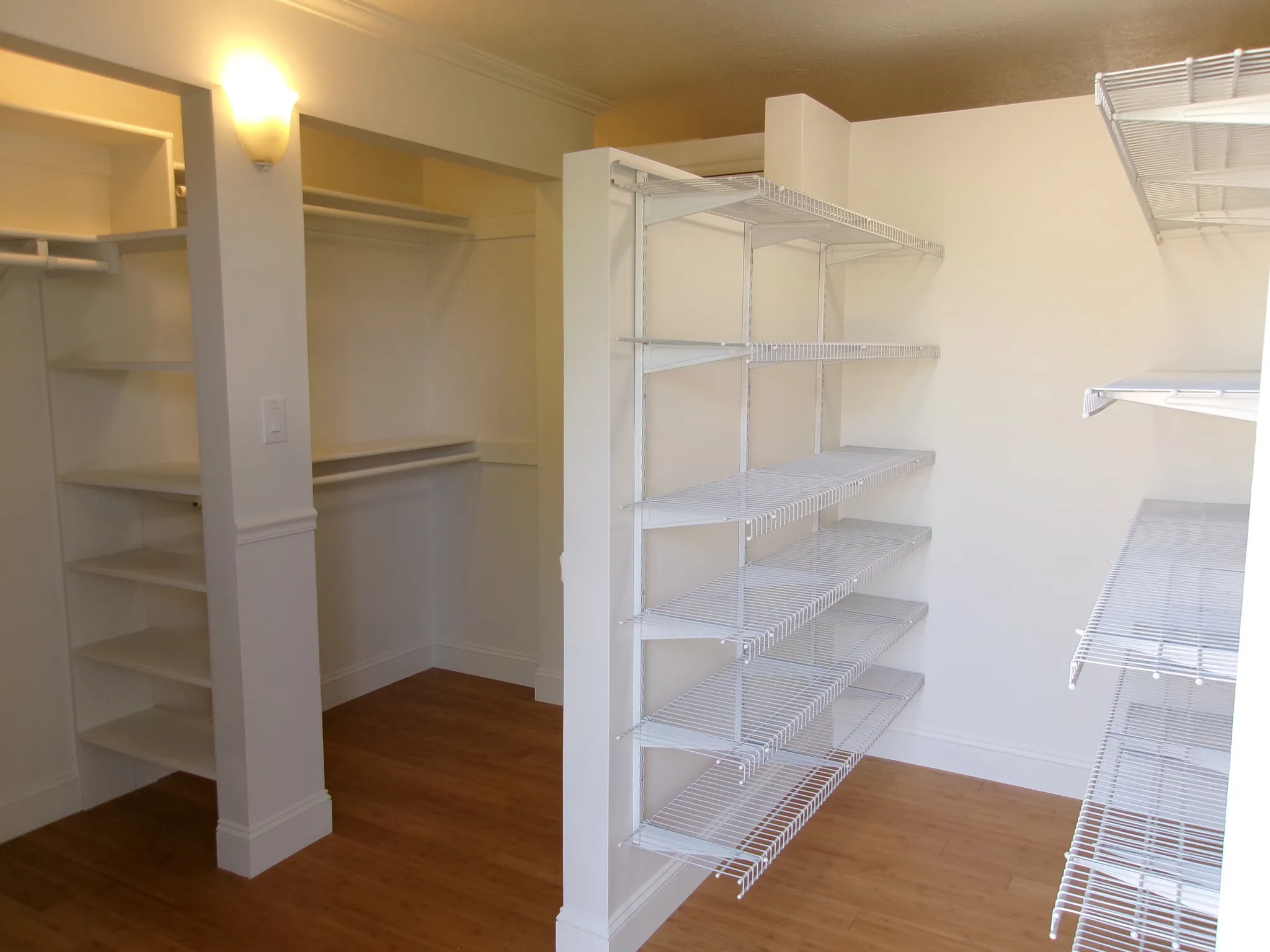 Master Bedroom Walk in closet featuring light wood-style floors 10 x 16