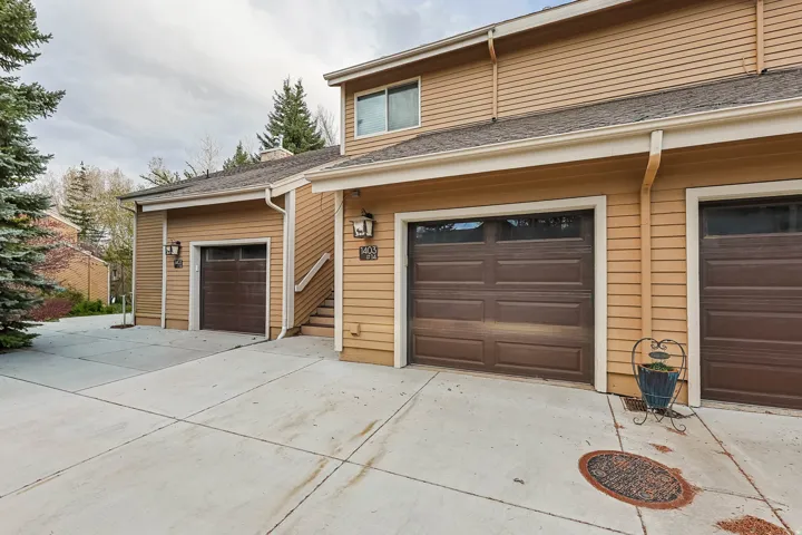 Garage featuring concrete driveway