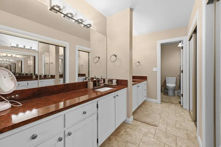Bathroom featuring vanity and light tile patterned floors
