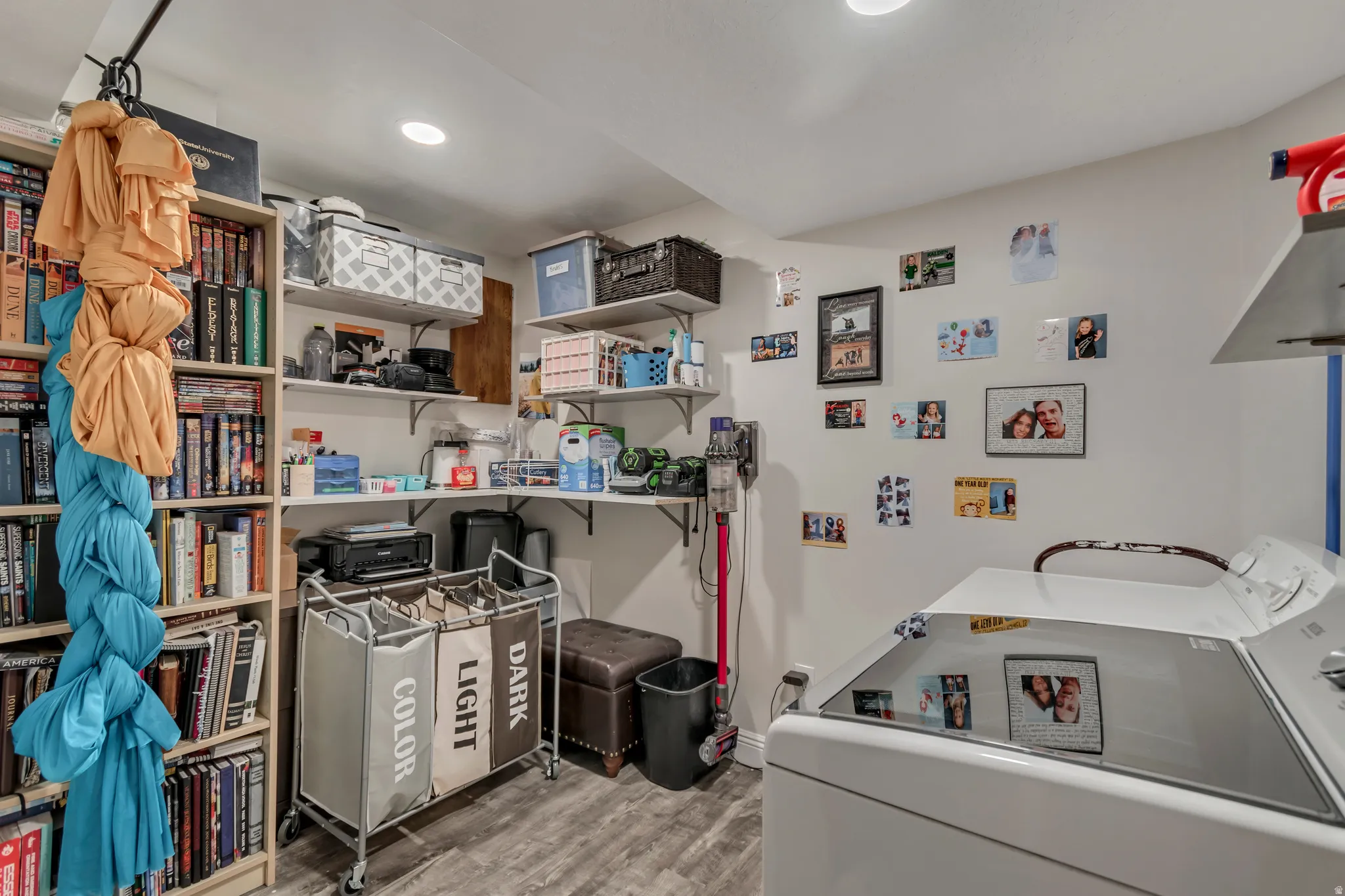 Laundry area featuring washer / dryer, light wood-type flooring, and recessed lighting