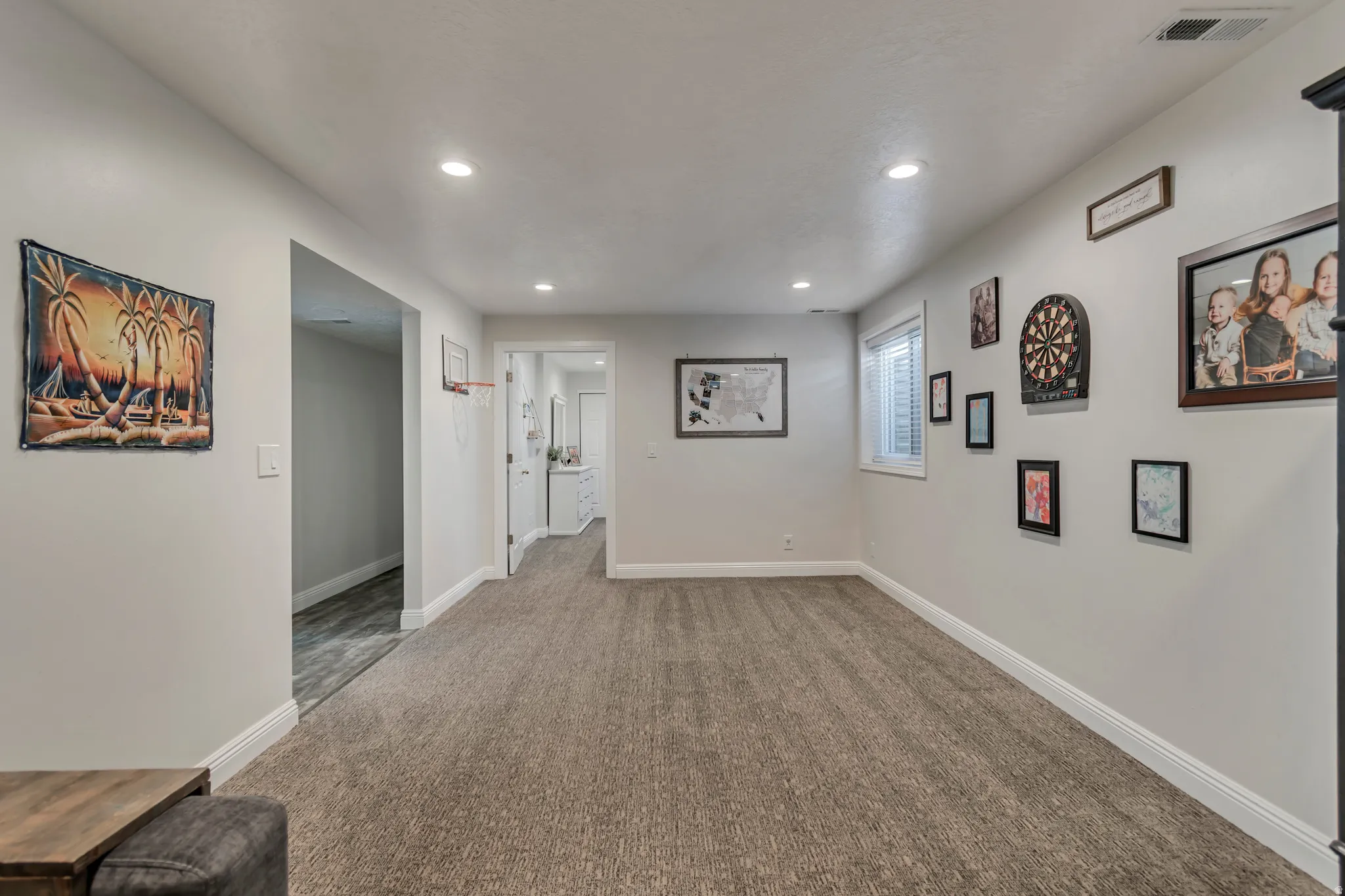 Hallway with carpet flooring and recessed lighting