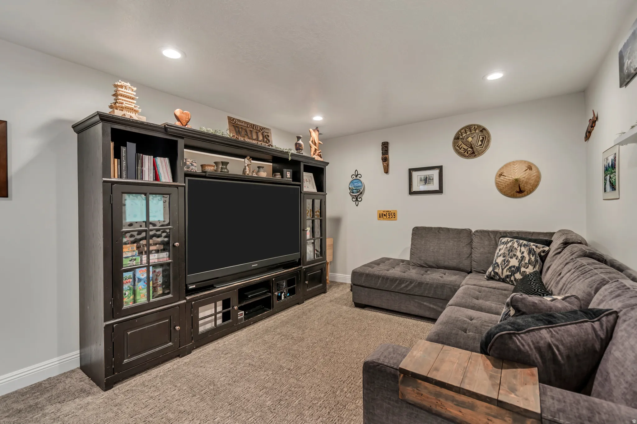 Living room featuring light carpet and recessed lighting