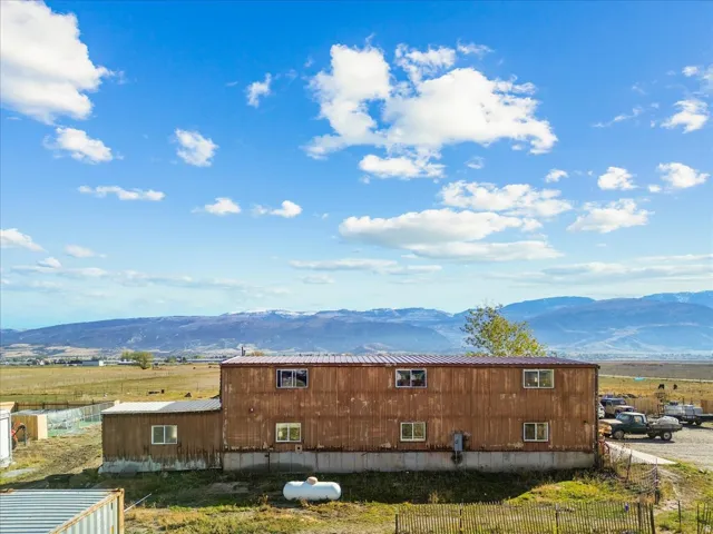 View of property exterior featuring a mountain view