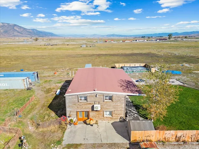 Aerial view of sparsely populated area with a mountainous background