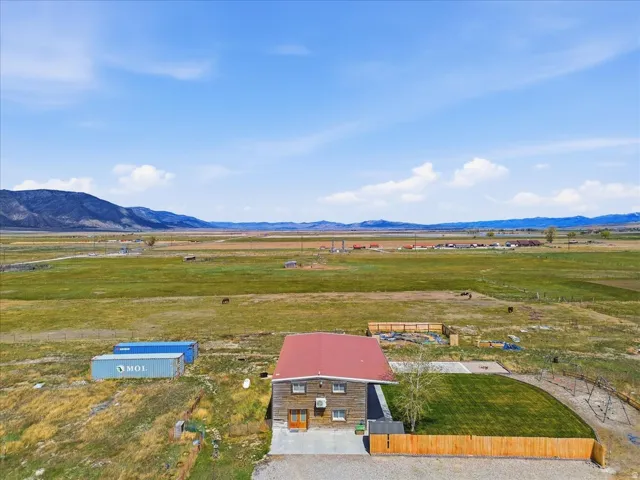 Aerial view of sparsely populated area featuring a mountain backdrop