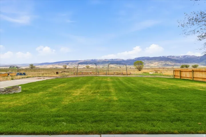View of yard featuring a mountain view and a view of rural / pastoral area
