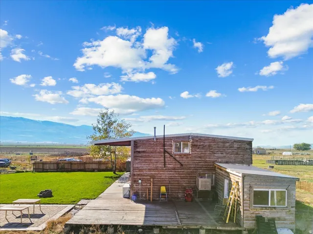View of side of property featuring a deck with mountain view
