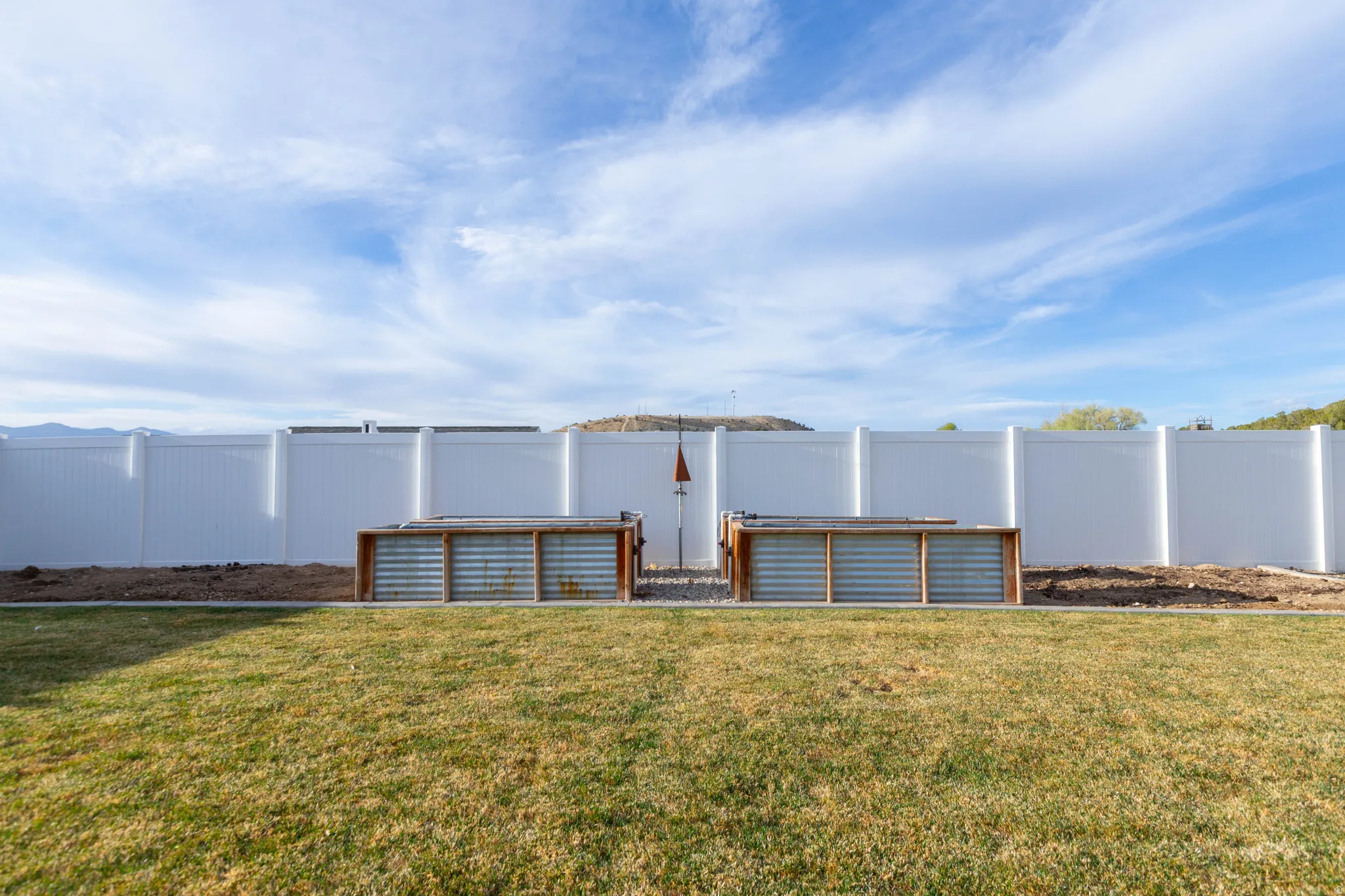 View of fenced backyard
