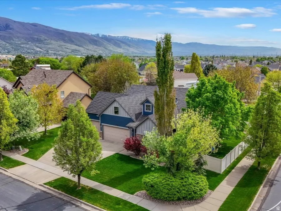 Aerial perspective of suburban area featuring a mountain backdrop