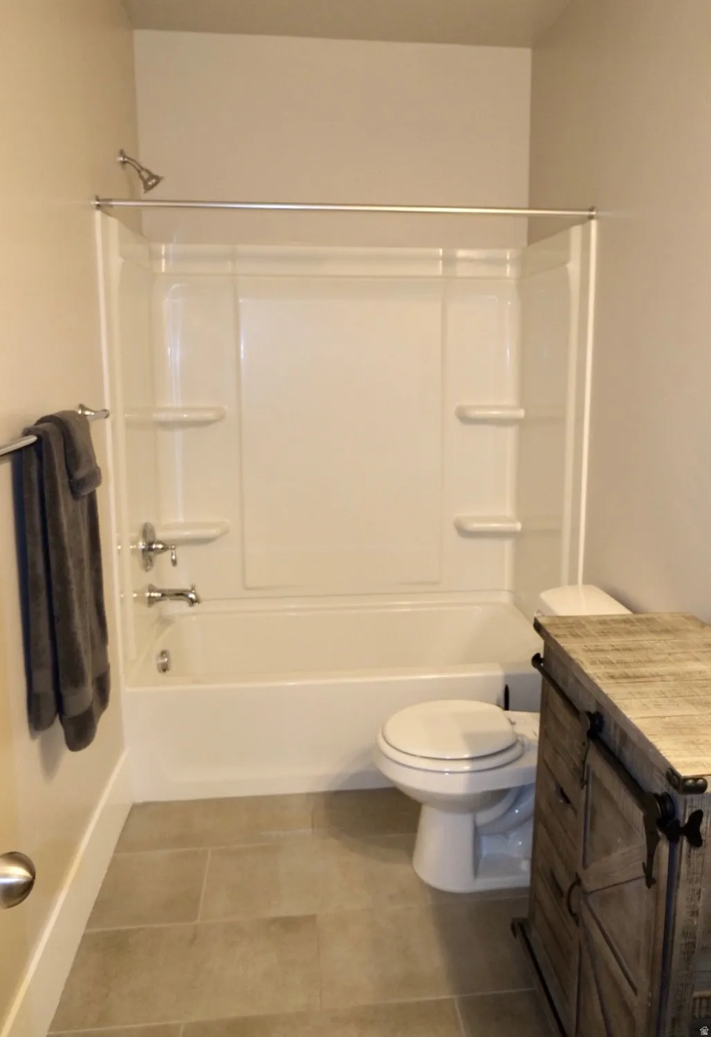 Bathroom with vanity and shower / bathtub combination