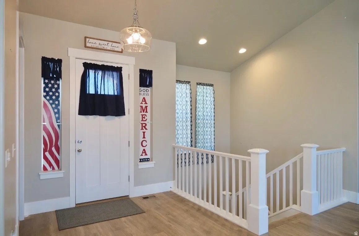 Entrance foyer featuring light wood-style floors and recessed lighting