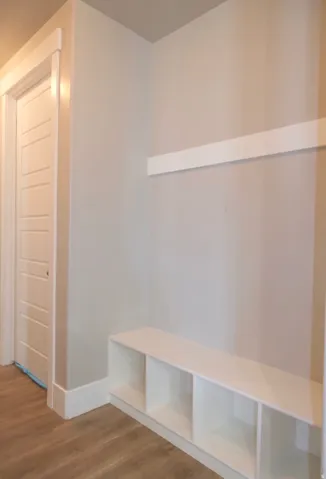 Mudroom featuring LVP finished floors and baseboards
