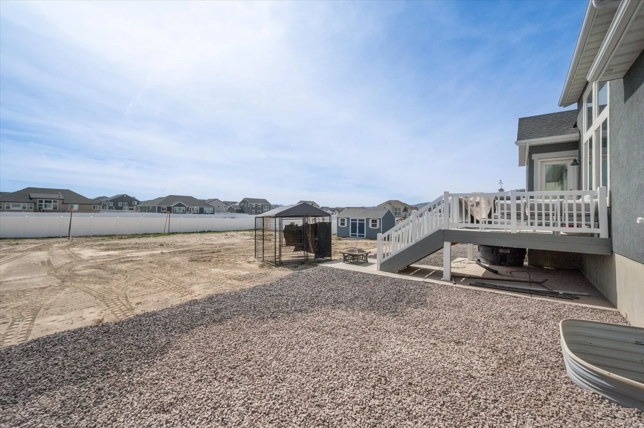 View of yard with a residential view, an outdoor fire pit, a patio area, and a deck