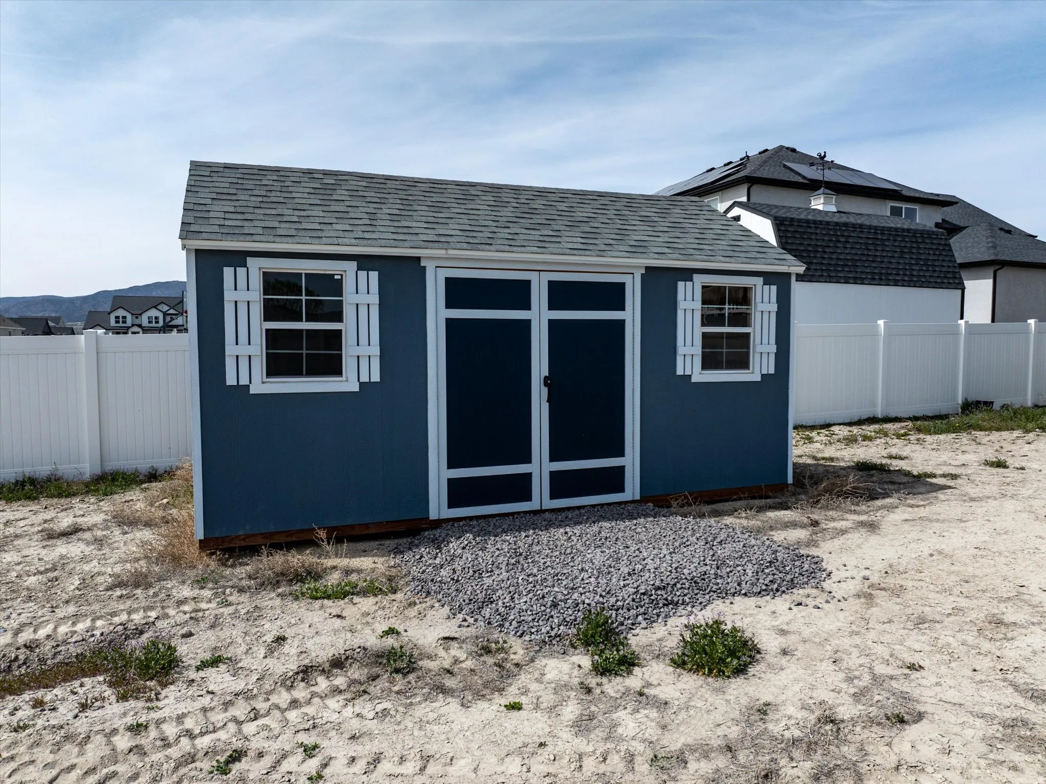 View of shed with a fenced backyard