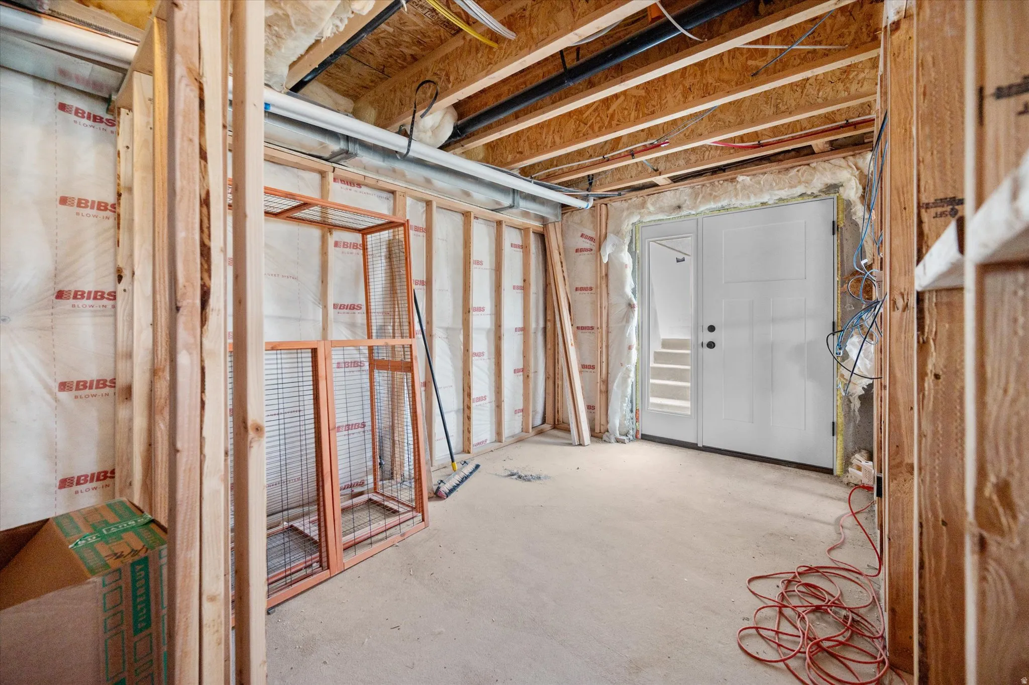 View of NEW walkout basement entrance. Future laundry area and mudroom