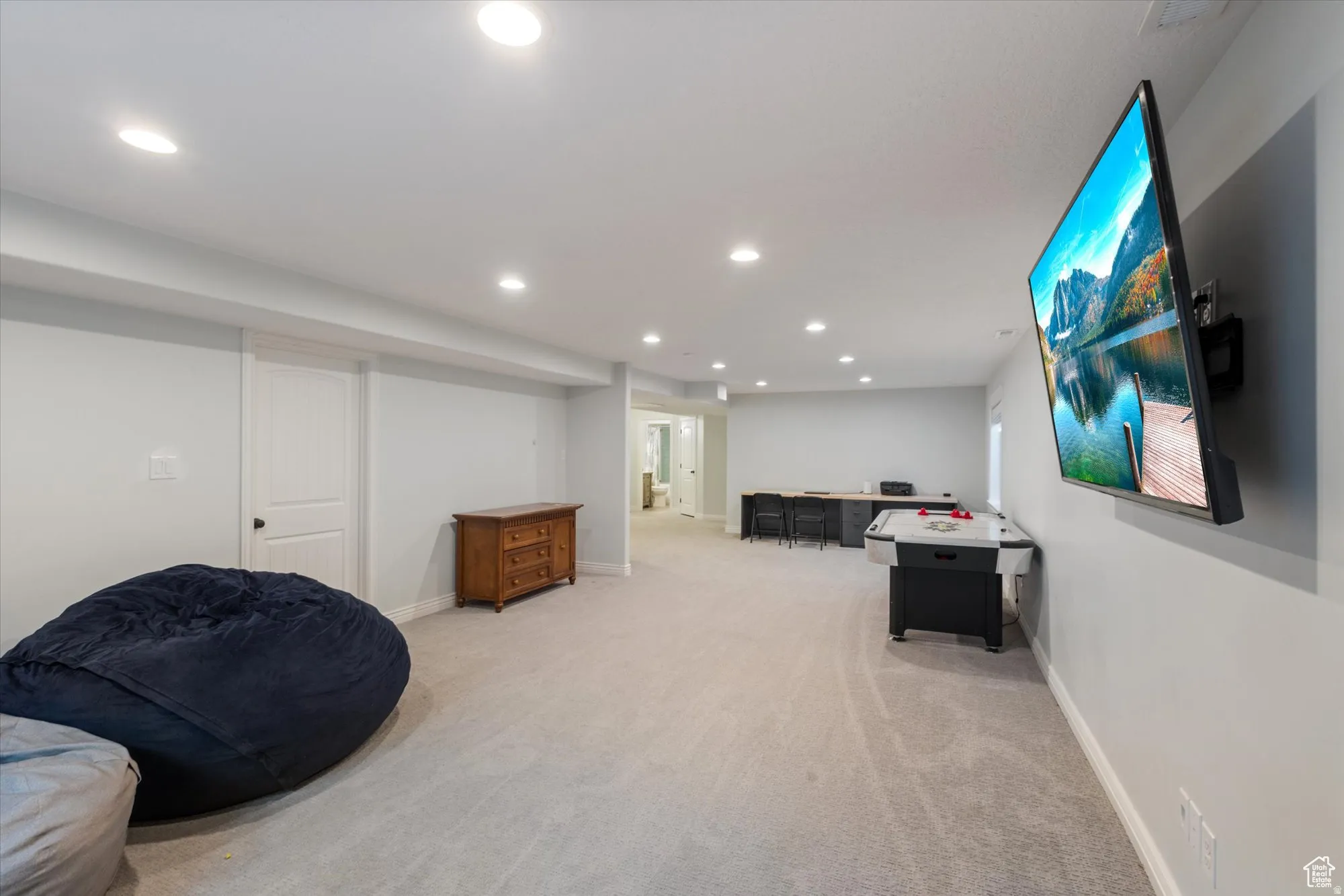 Rec room featuring light colored carpet and recessed lighting