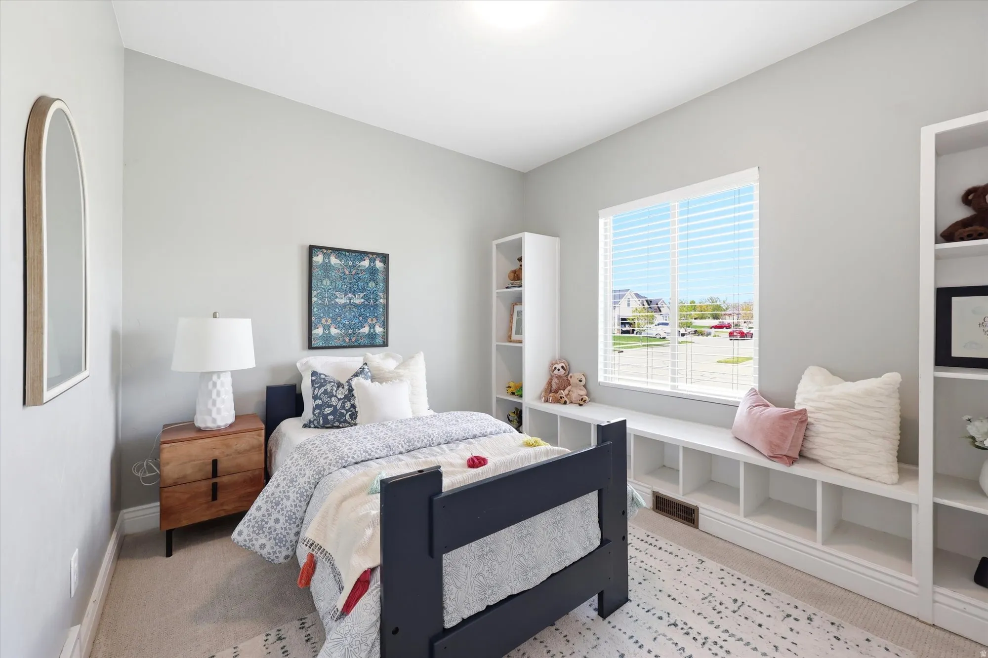 Bedroom featuring light colored carpet and baseboards