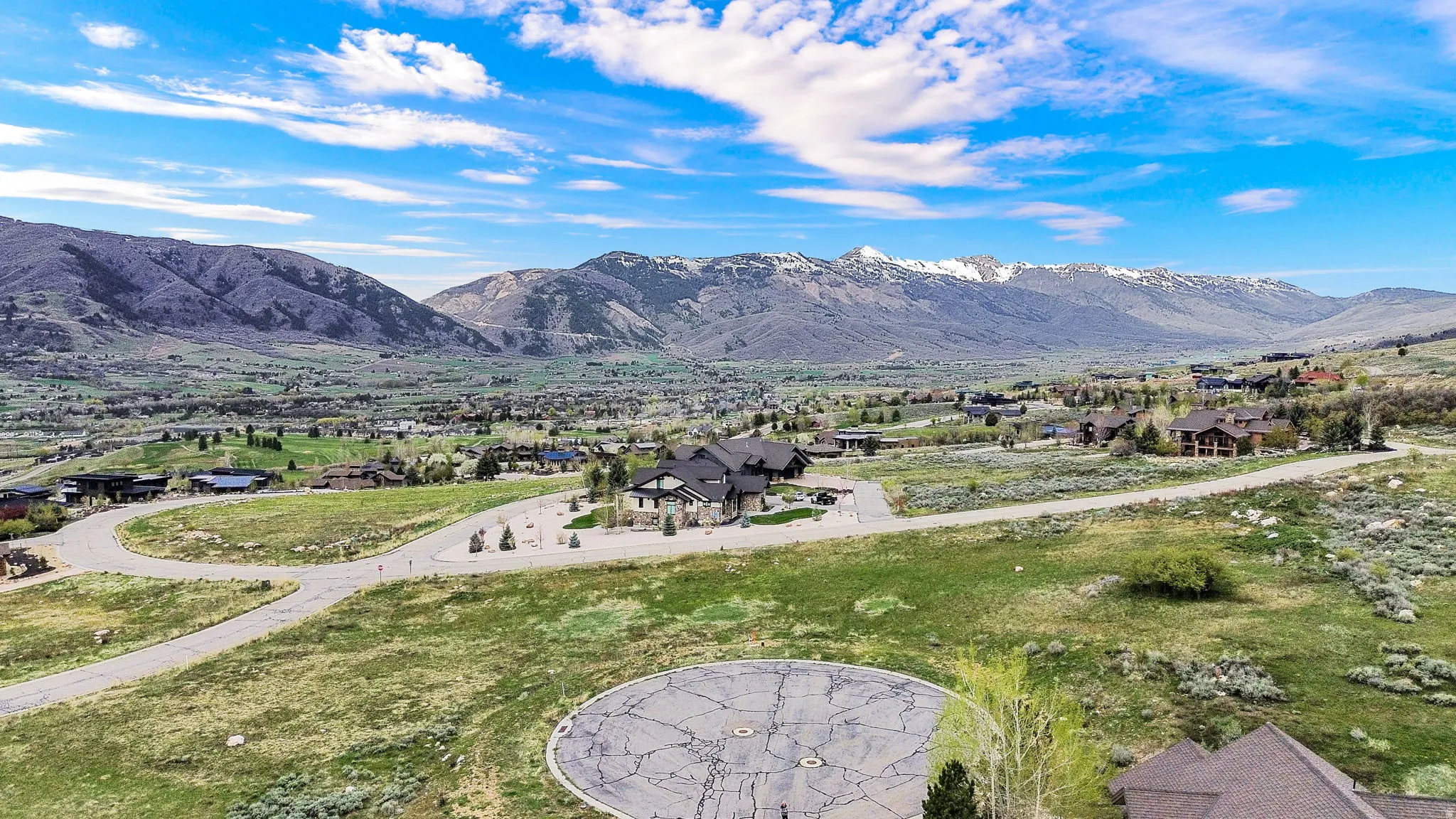 View of mountain backdrop featuring nearby suburban area