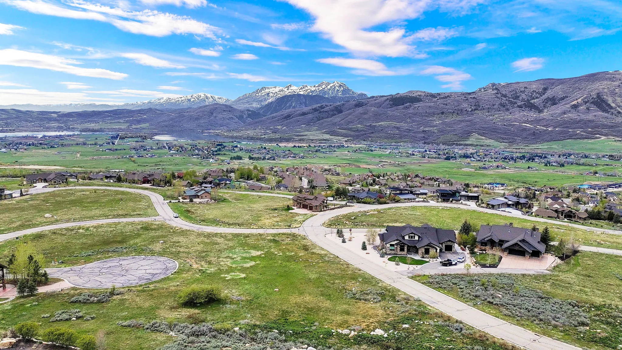 Aerial view of residential area featuring a mountain backdrop
