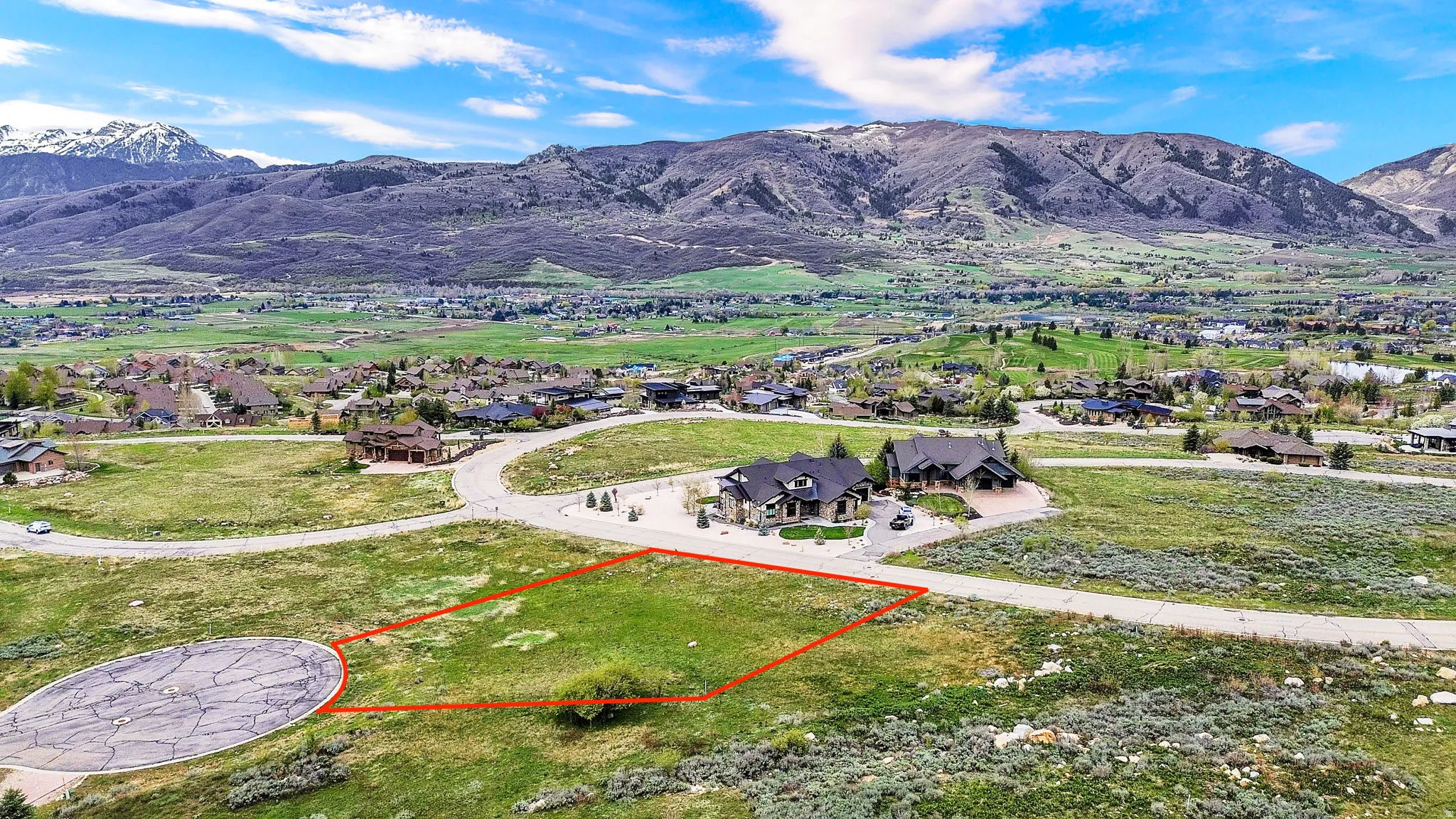 View of mountain backdrop with nearby suburban area