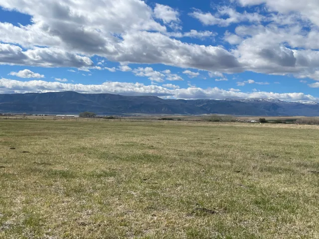 View of mountain backdrop featuring rural landscape