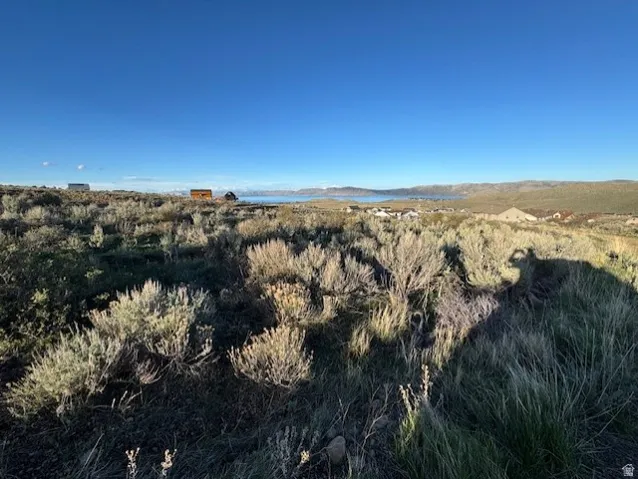 View of mountain backdrop featuring a nearby body of water
