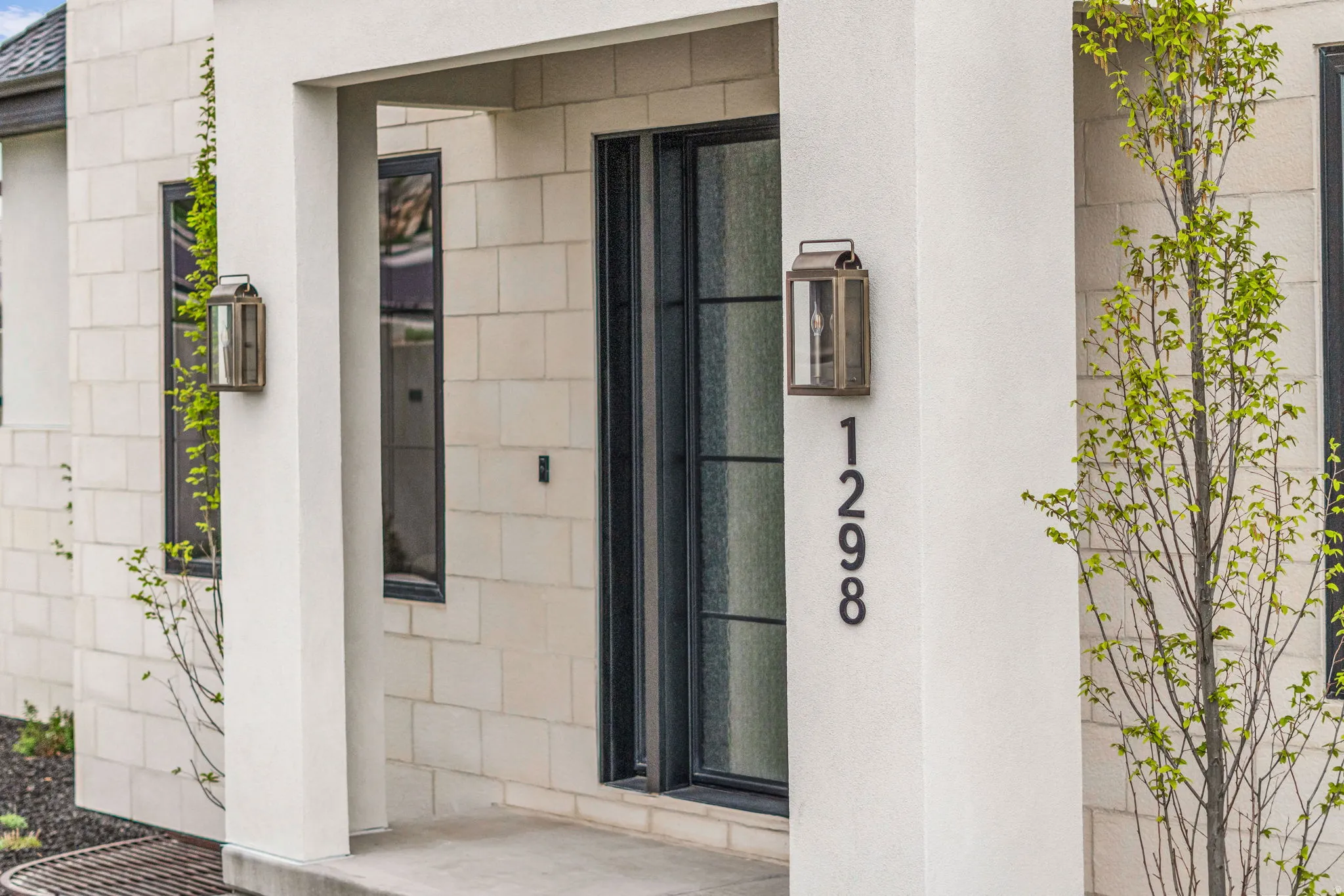 Property entrance with stucco siding
