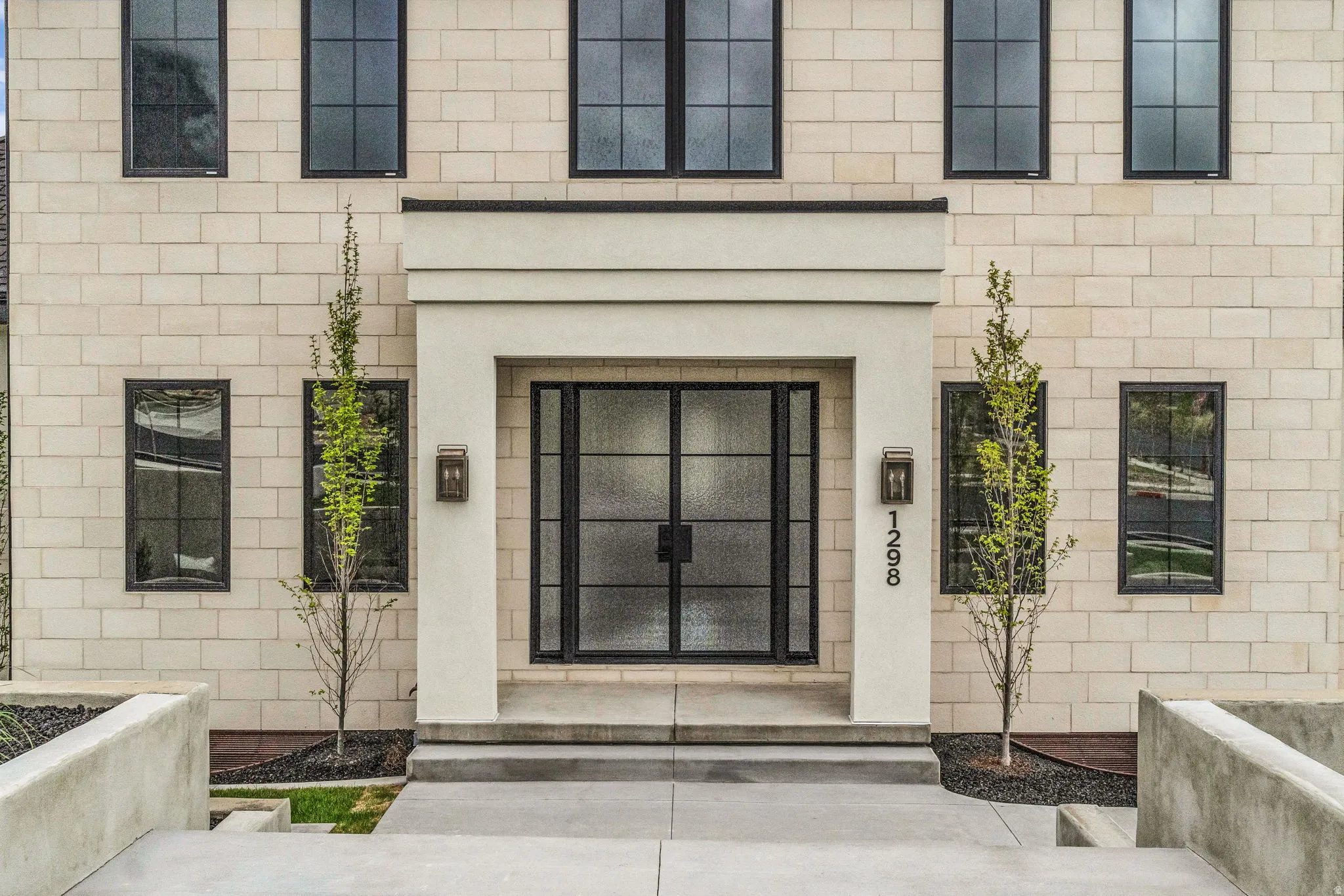 View of exterior entry with stucco siding