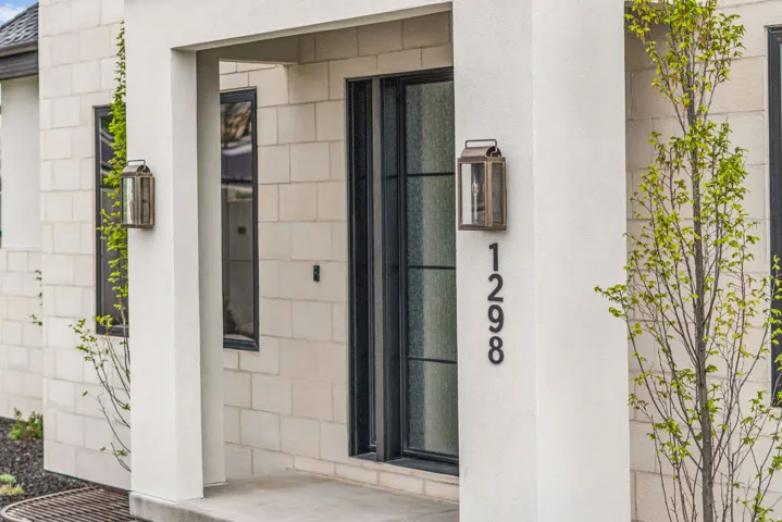 Property entrance with stucco siding
