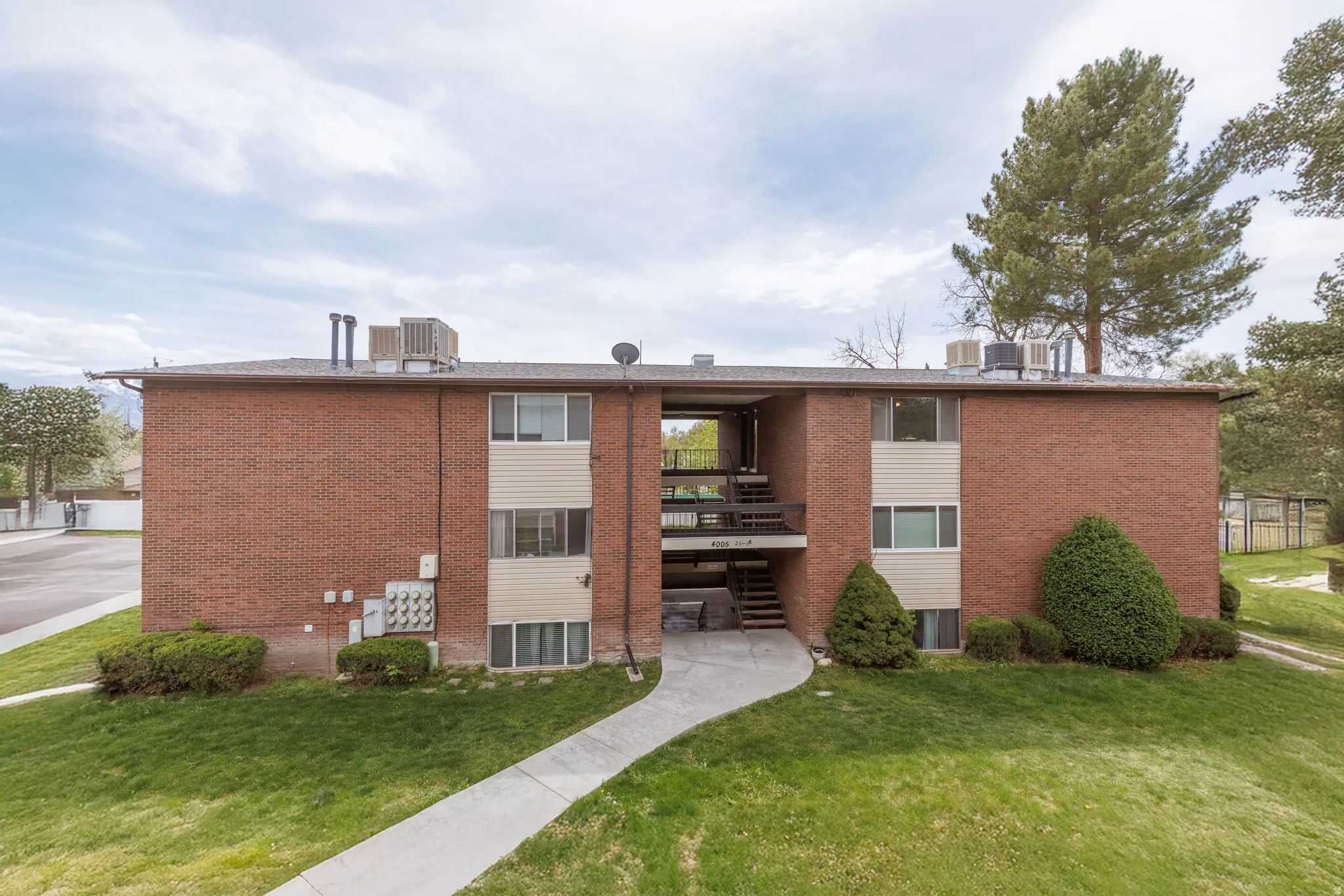 View of apartment building / complex featuring stairs