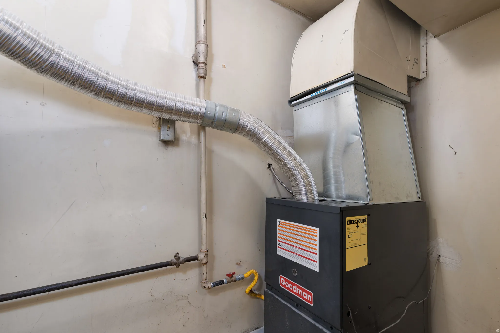 Utility room featuring heating unit
