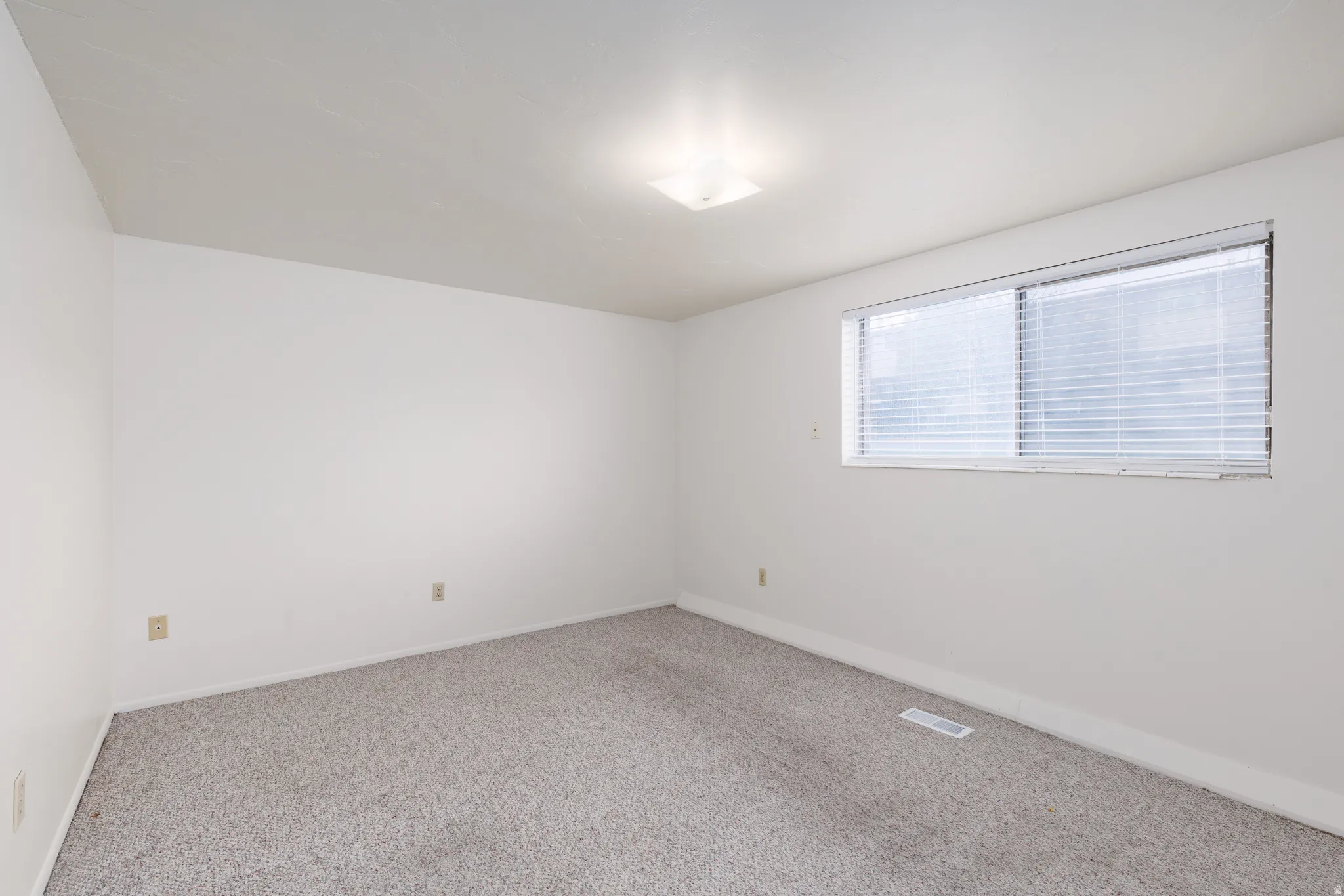 Spare room with carpet flooring and baseboards
