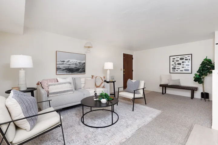 Living room featuring light-toned carpeting and neutral wall tones