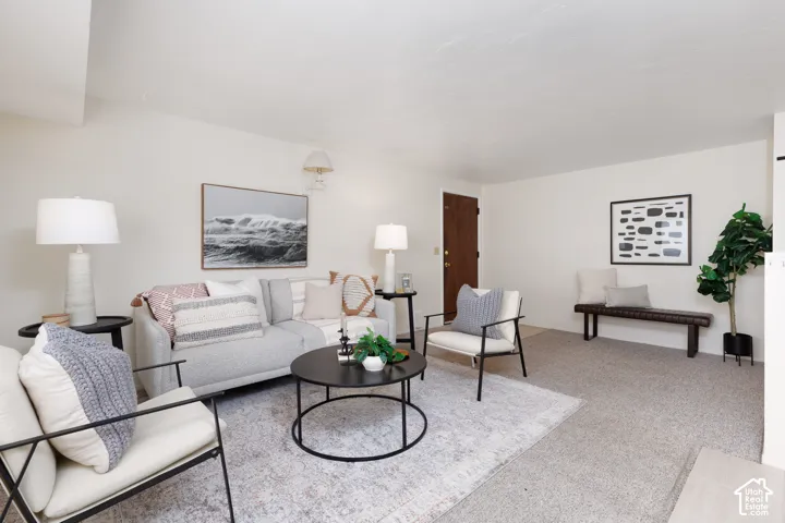 Living room featuring light-toned carpeting and neutral wall tones
