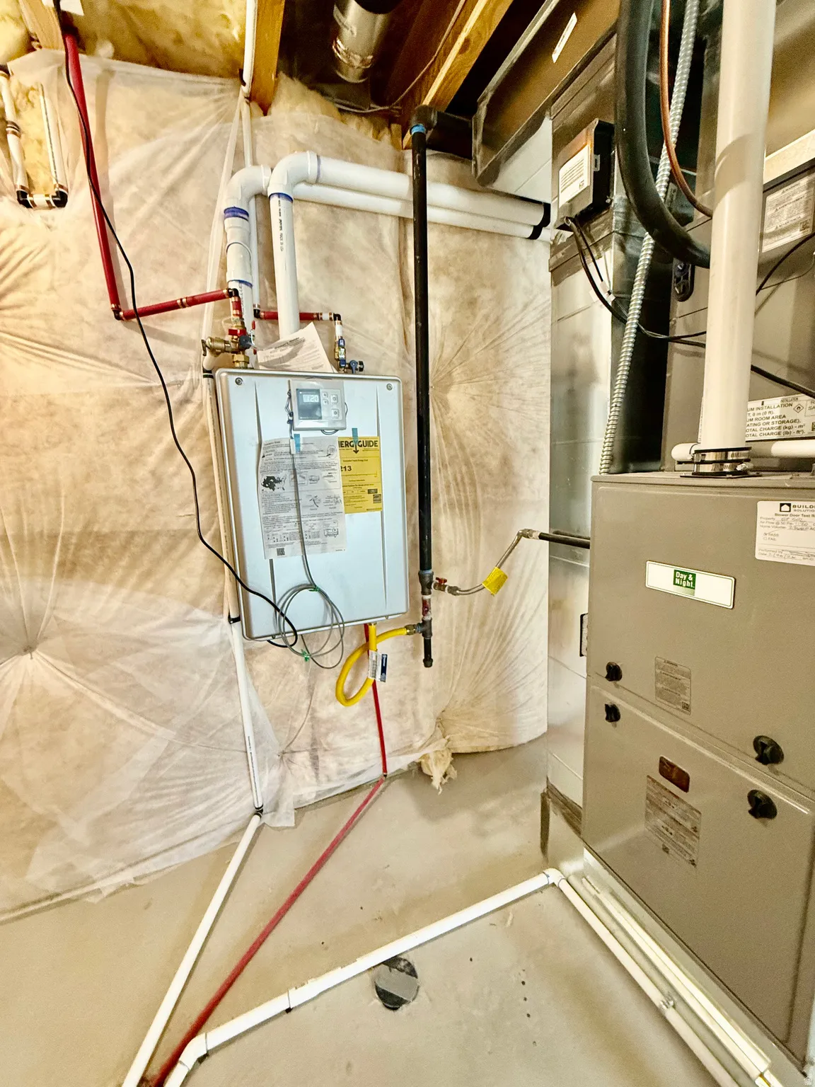 Utility room featuring heating unit