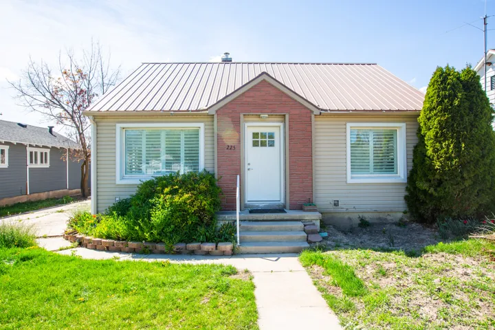 Bungalow-style house featuring a metal roof