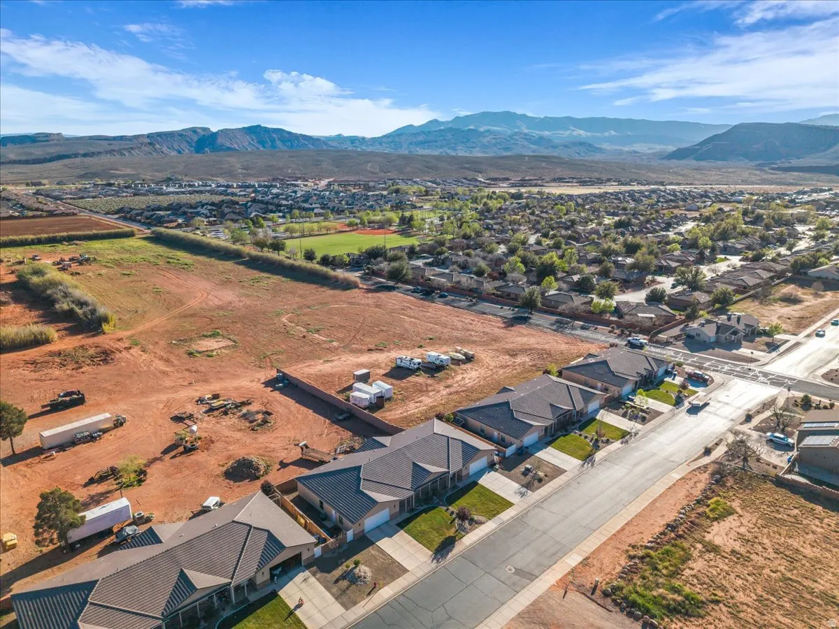 Aerial view of residential area featuring a mountain backdrop