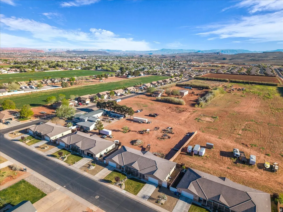 Aerial perspective of suburban area featuring a mountain backdrop