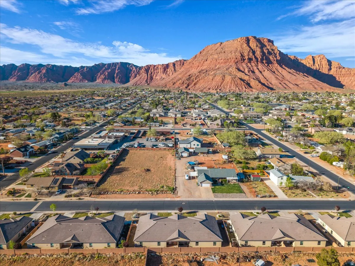 Aerial view of residential area featuring a mountain backdrop
